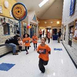 Students running at the Apex fun run