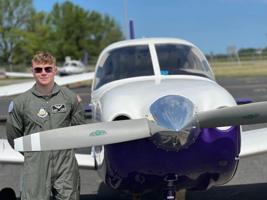 Ramsey Stark in uniform next to a plane
