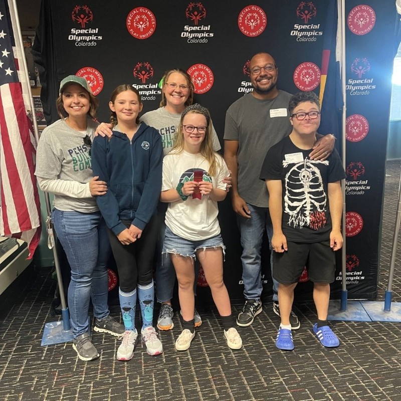 Group shot in front of Special Olympics banner