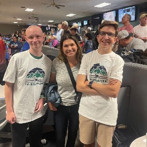 Three bowlers smiling