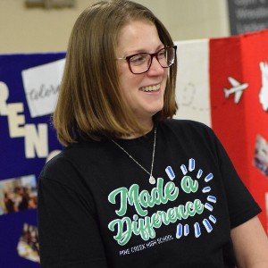 Teacher wearing shirt that says, "Made a Difference"