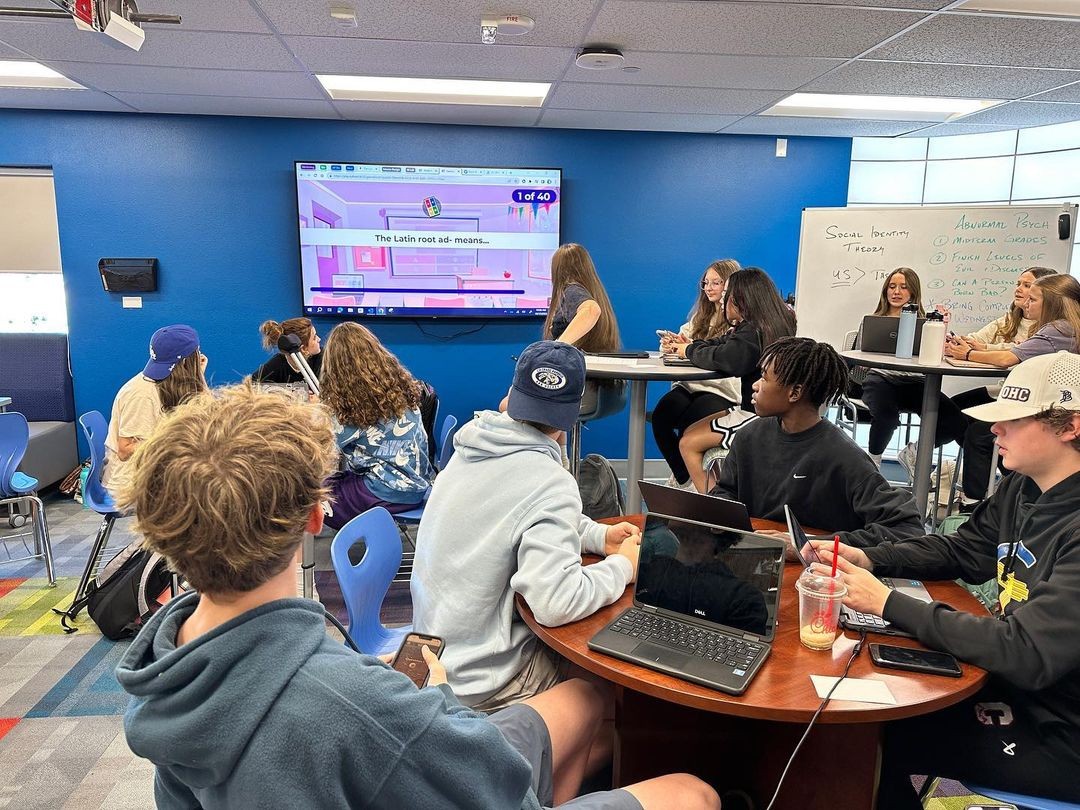 Students in class at VHS learning about latin