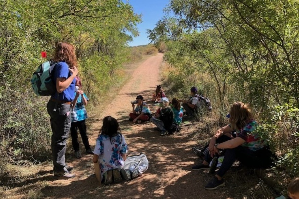 Students studying on a trail.